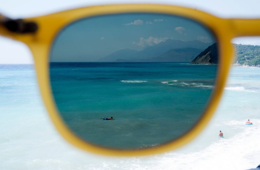 Dark blue water at a beach is brought into focus and clarity thanks to a pair of polarized sunglasses.